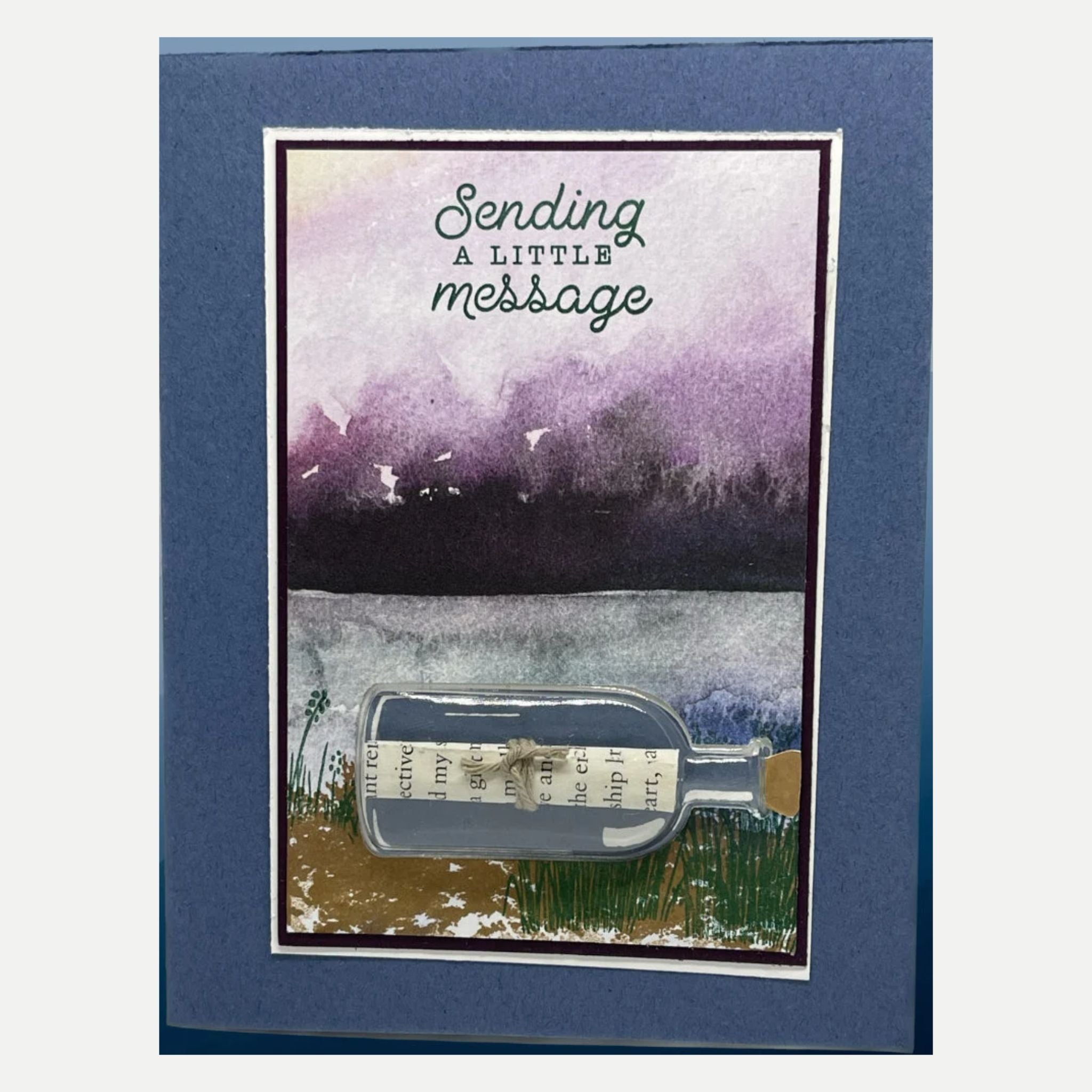 Sending a little message in card that has a 3D message in a bottle. Mountain and lake background