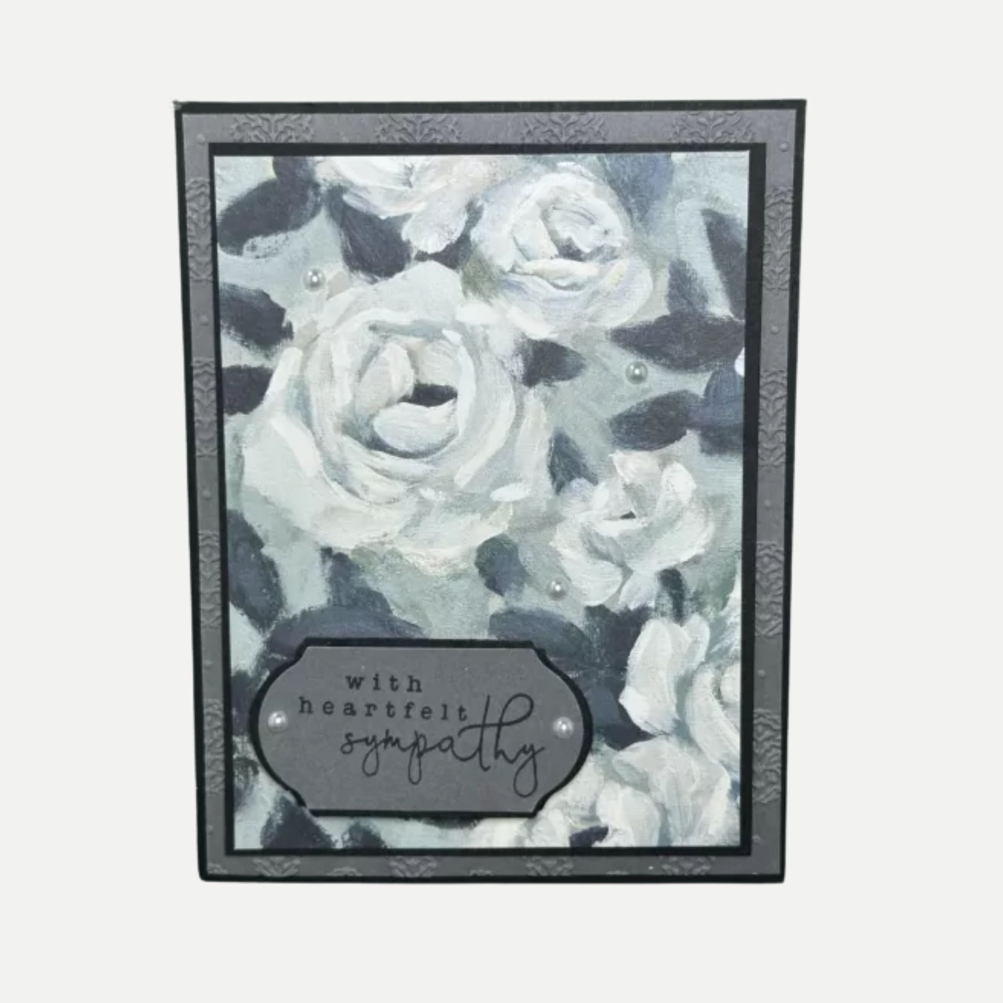 Elegant sympathy card with soft black and white roses, heartfelt message for comfort