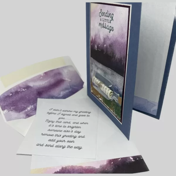 Sending a little message in card that has a 3D message in a bottle. Mountain and lake background