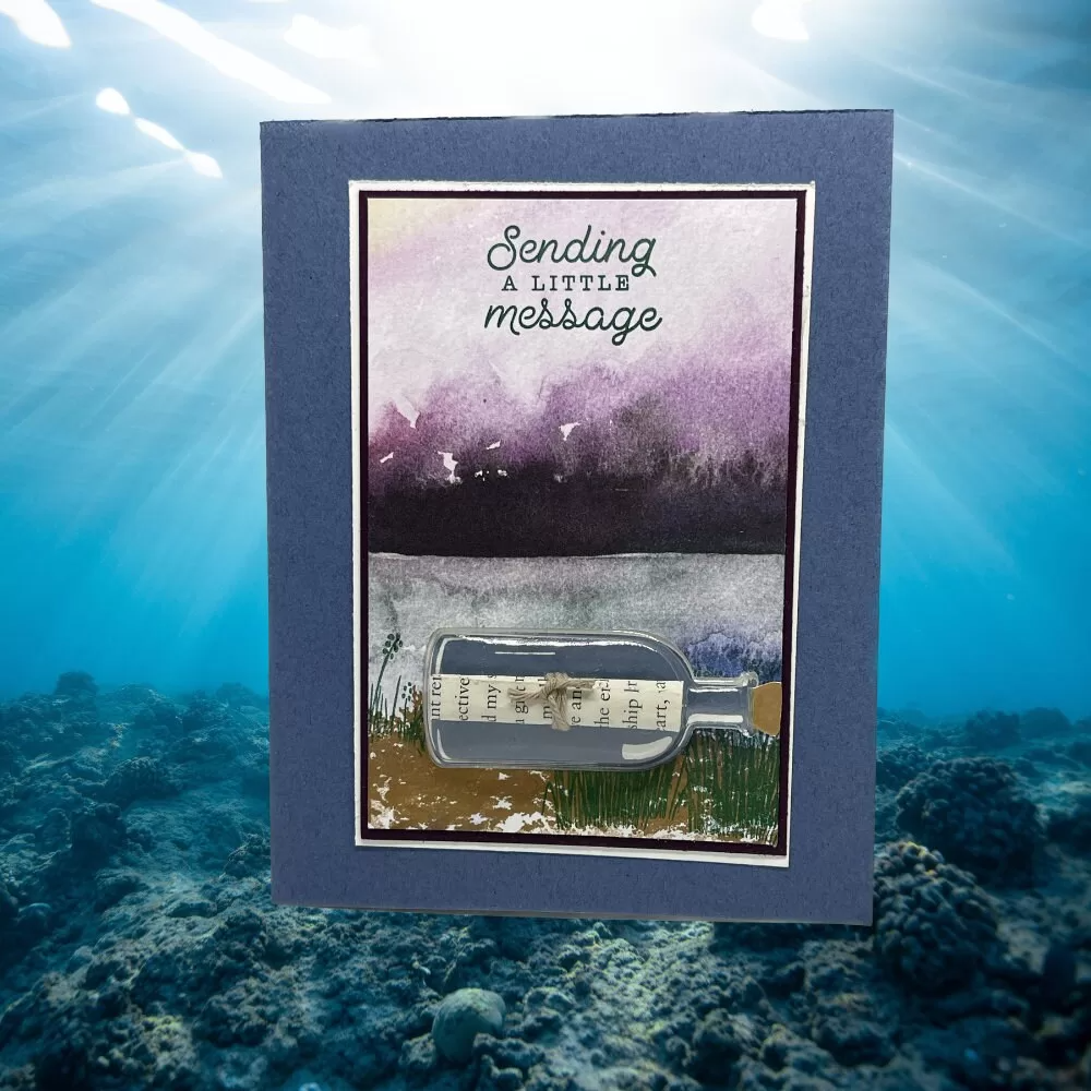 Sending a little message in card that has a 3D message in a bottle. Mountain and lake background