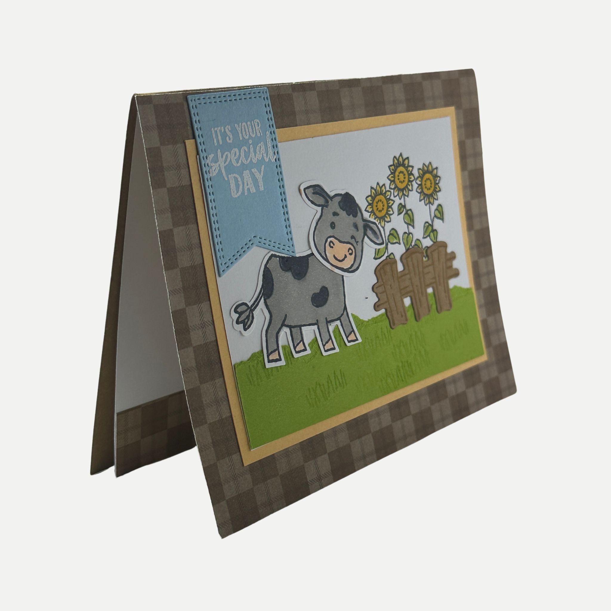 Side angle view of handmade farm-themed birthday card showing layered cardstock and dimensional details.