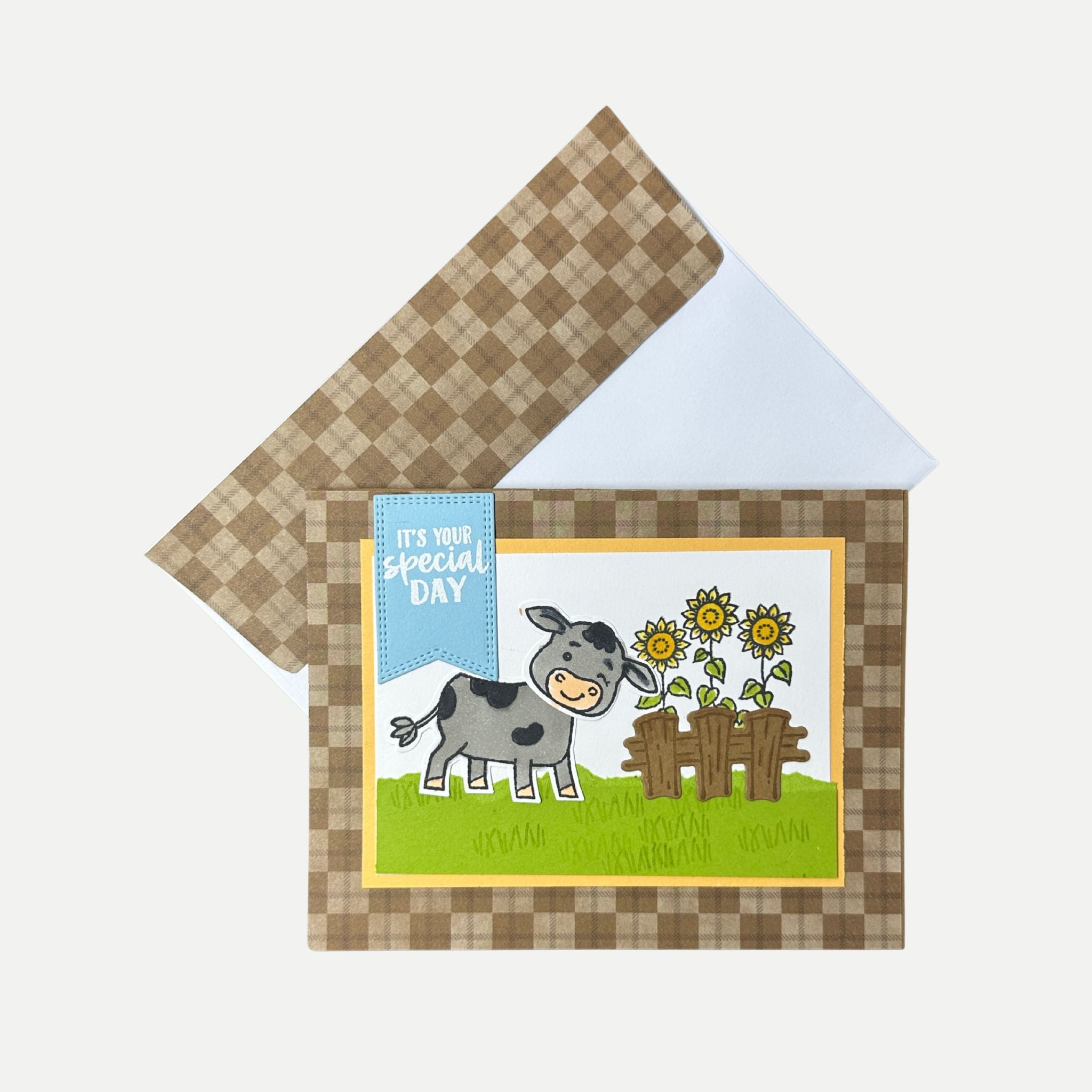 Rustic handmade birthday card displayed with coordinating plaid-lined envelope.