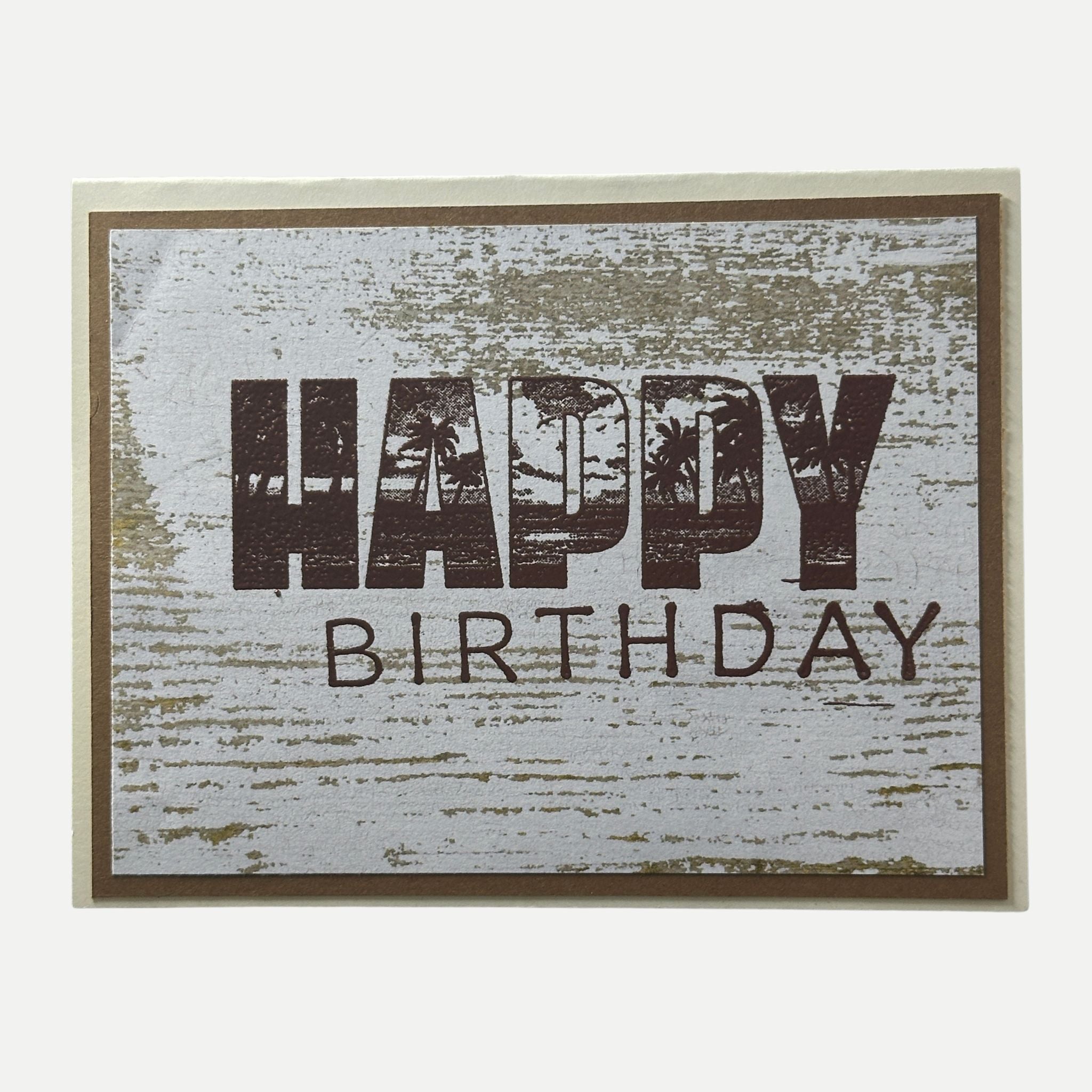 Rustic handmade birthday card with copper foil Happy Birthday lettering and palm tree design.