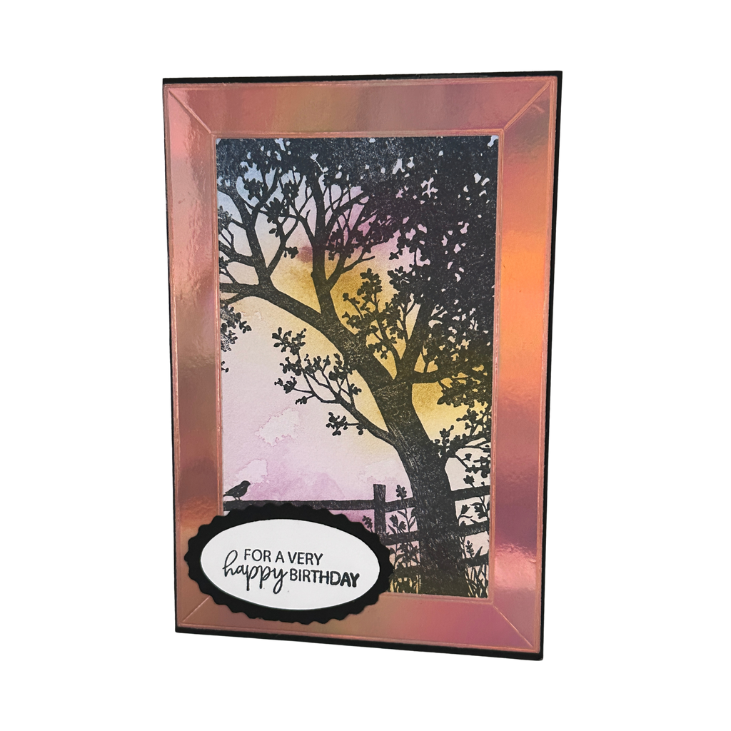 Handmade birthday card featuring a black tree silhouette against a pink and golden watercolor sky with a "For a Very Happy Birthday" greeting.