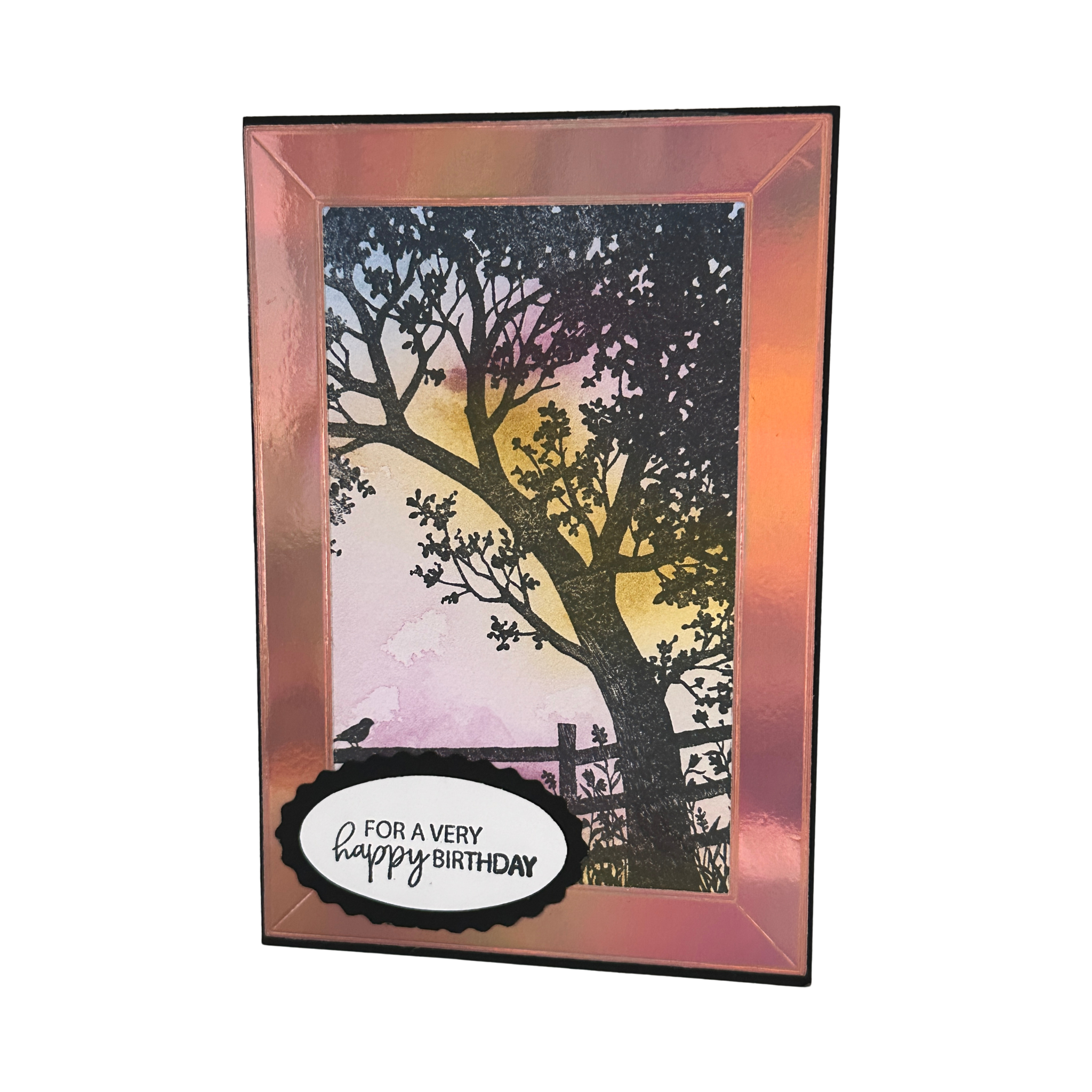Handmade birthday card featuring a black tree silhouette against a pink and golden watercolor sky with a "For a Very Happy Birthday" greeting.